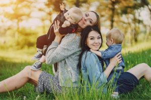 Happy intended parents smiling together while choosing a smaller surrogacy agency.
