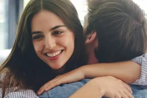 Happy intended parents smiling together while researching a surrogacy agency with no waitlist