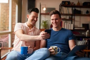 Gay male couple learning about the surrogate matching process as intended parents